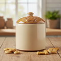 Ceramic paw print pet treat jar with lid on a wooden surface